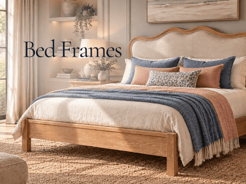 Wooden bed frame with curved upholstered headboard and layered bedding